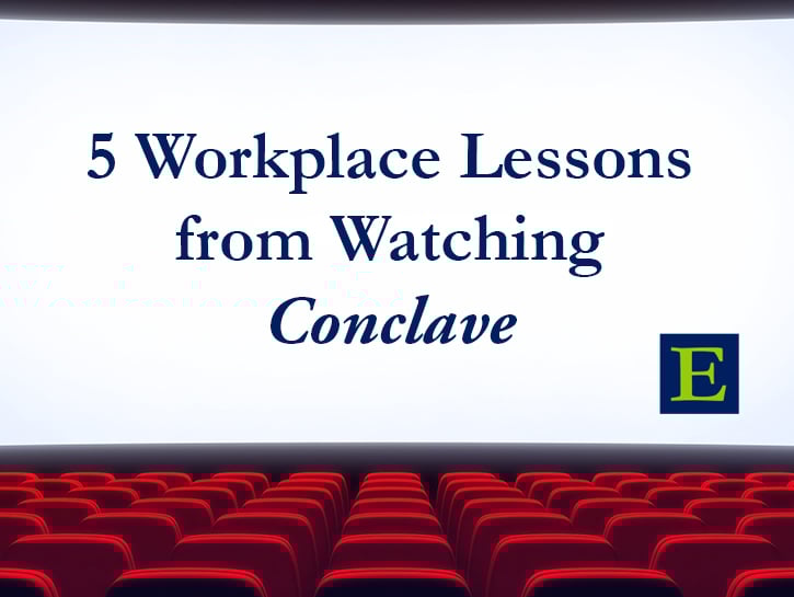 Movie screen with 5 Workplace Lessons from Watching Conclave onscreen with ECLARO E and red seats