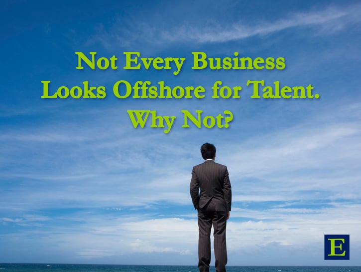 Man in suit looking out at horizon of water and blue sky with copy Not Every Business Looks Offshore for Talent. Why Not?